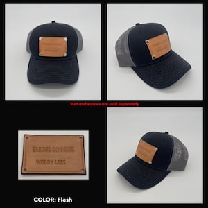 May include: A black and grey trucker hat with a brown leather patch that says "Ride More Worry Less". The patch is attached to the hat with silver screws. The hat is available in the color "Flesh".