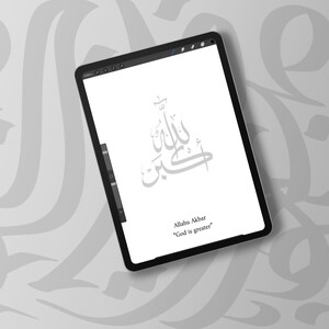 May include: A digital tablet displays Arabic calligraphy in a minimalist style. The text reads "Allahu Akbar" with the English translation "God is greater" below. The background features a subtle, repeating pattern of calligraphy.