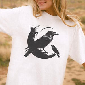 Black Raven Crescent Moon T-Shirt | Gothic Raven Moon Tee Spooky Halloween Gift for Bird Lovers | Vintage Graphic Goth Aesthetic Crow Shirt