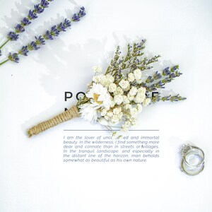 May include: A small bouquet of dried white and lavender flowers tied with twine. The bouquet is on a white surface with a quote about the beauty of nature.