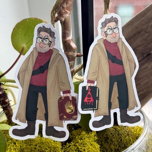 May include: Two stickers featuring a cartoon character in a tan coat, red sweater, and black pants, holding a book. The character wears glasses and has a black strap across the chest. The books are dark red with gold accents.