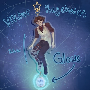 May include: A Viktor keychain, 3.5 inches in height, featuring a character illustration with a star-shaped clasp. The keychain has a glowing orb at the bottom and the word "Glows" is written on the image.