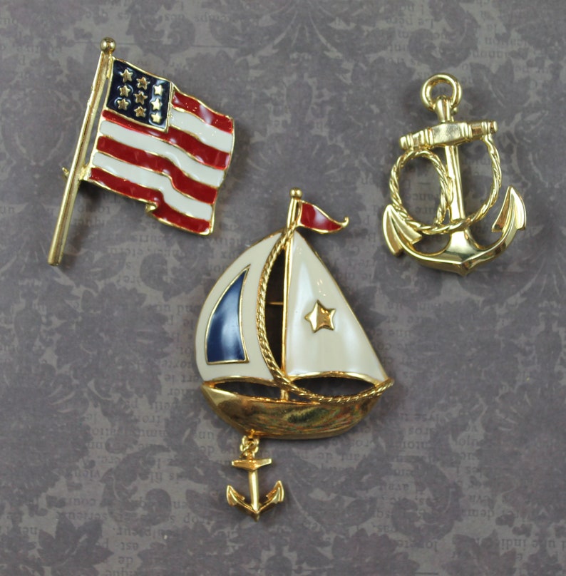 Lot of 3 Gold Tone Enamel American Flag and Nautical Themed Brooches image 1