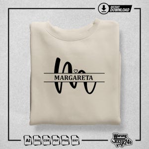May include: A beige sweatshirt with a black graphic design featuring the name "MARGARETA" in a split-line style with a small heart symbol above the name.