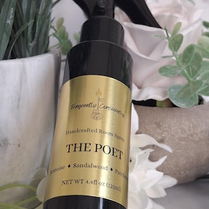 May include: A black room spray bottle with a gold label that reads "THE POET." The label also lists ingredients: Armoise, Sandalwood, and Patchouli. The bottle contains 4.4 fl oz (125ml) of product. The spray nozzle is black.