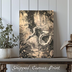 Peut inclure: Impression sur toile sépia représentant un serpent enroulé sur une branche d'arbre dans une jungle. L'œuvre d'art comprend une végétation luxuriante, une rivière et le texte "Shipped Canvas Print" en bas.