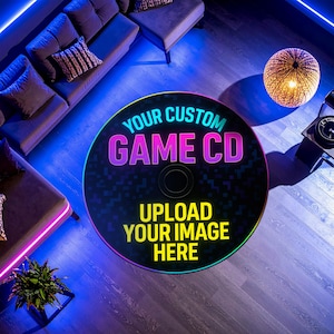 May include: A custom game CD featuring the text "YOUR CUSTOM GAME CD" in pink and purple, and "UPLOAD YOUR IMAGE HERE" in yellow. The CD has a black, pixelated design and a central hole. The image is taken from an overhead perspective.