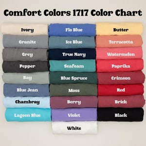 a color chart with various colored t-shirts arranged in a grid, each shirt having a different color.