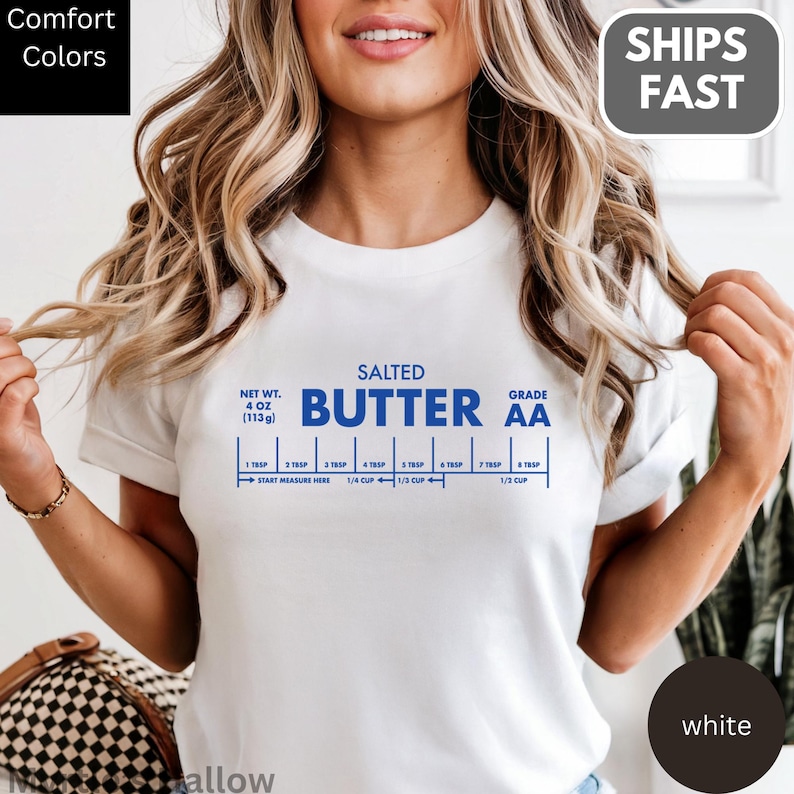 A woman wearing a white t-shirt with a blue and white design that appears to be a recipe for salted butter.