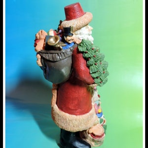 10" Tall Santa Claus Carring Christmas Tree. Antique Hand Pained