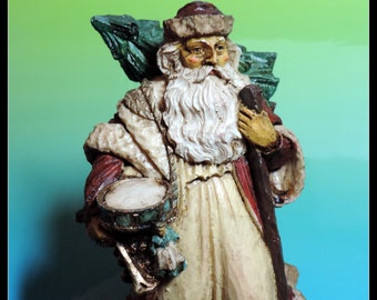 Over 7" high Santa Claus carrying Christmas Tree. Antique hand pained Collectible Christmas figurine, decoration. Good vintage condition
