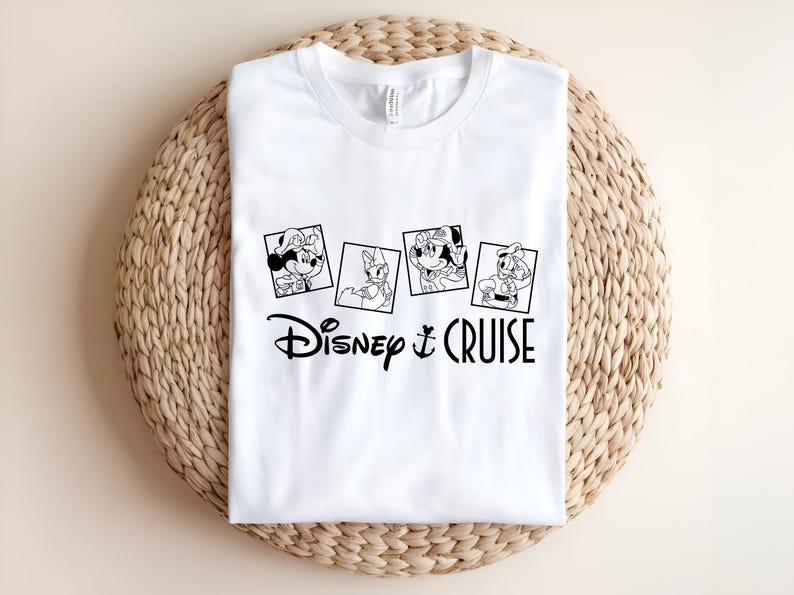 May include: White t-shirt with a black and white graphic of Mickey Mouse, Minnie Mouse, Donald Duck, and Goofy in a photo booth. The text "Disney Cruise" is below the photos.