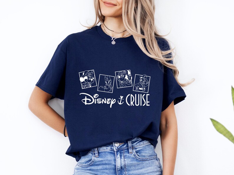 May include: A navy blue t-shirt with a white graphic of four Disney characters in squares. The text "Disney Cruise" is below the characters.