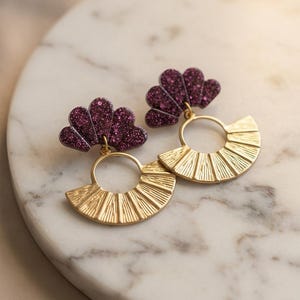 CLAIRE > Resin and glitter drop earrings https://www.instagram.com/capetille_jjl?igsh=MW5ueHBwcngzaXltaA