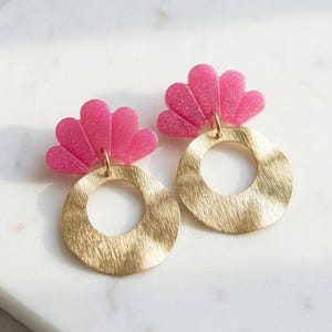 CLAIRE > Resin and glitter drop earrings https://www.instagram.com/capetille_jjl?igsh=MW5ueHBwcngzaXltaA