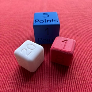 May include: Three dice, one blue, one white and one red. The blue die has the number 5 and the text "Points" on it. The white die has the number 20 on it. The red die has the number 1 on it.