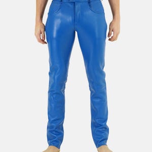May include: Bright blue leather pants with a classic five-pocket design. The pants have a button and zipper closure and are made of a shiny, smooth material. The pants are a solid color and have a tailored fit.