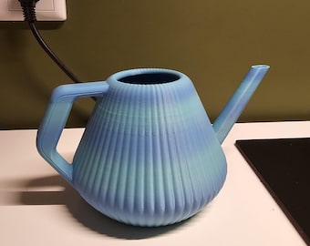 May include: A blue and green watering can with a ribbed design. The watering can has a spout and a handle.