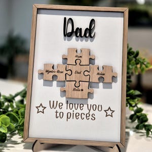 May include: A rustic wooden sign with the text "Welcome to our home" in white lettering. The sign features a distressed finish and a simple, inviting design, perfect for entryway decor.