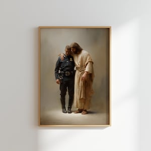 May include: Framed print featuring a painting of a police officer being embraced by a figure in flowing robes. The officer wears a dark blue uniform. The other figure has long hair and a light brown robe. The artwork is set against a neutral background.