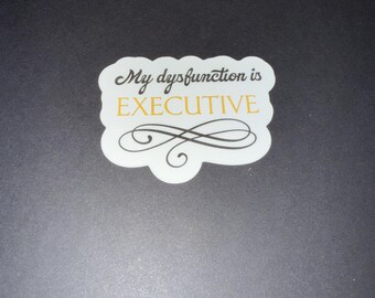 May include: White sticker with black cursive text that reads "My dysfunction is EXECUTIVE" with a decorative black swirl design.