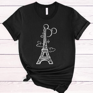 May include: Black t-shirt featuring a white outline of the Eiffel Tower, Mickey Mouse ears, and hearts. The design is centred on the shirt.