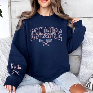 favorite daughter mom sweatshirt personalized, daughter est 2003 shirt for mother, custom sleeve name sweatshirt, pink black white print options, mother daughter matching aesthetic gift clothing