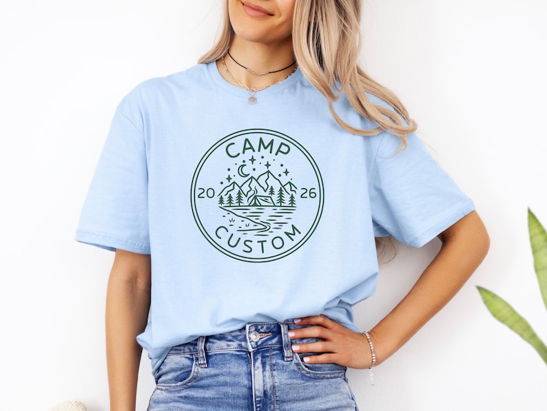 camp custom t shirt with year 2026 outdoorsy adventure tee minimalist camping logo mountain scene forest trees night sky moon stars travel vacation shirt