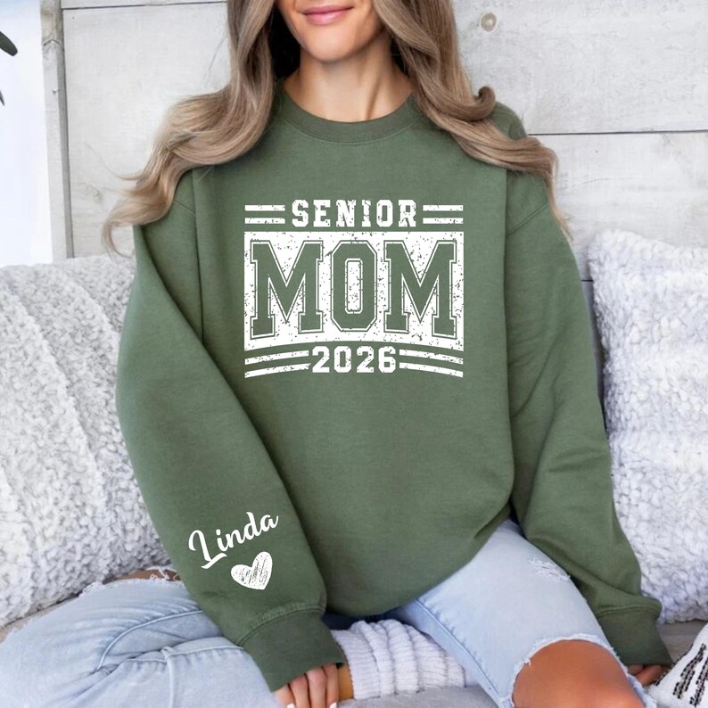 Graduation Mom Shirt, Senior Mom 2026 Crewneck, Class of 2026 Tee, School Spirit Wear for Moms, Personalized Sleeve Heart Shirt, Custom Graduation Parent Clothing, Varsity Print Mom Shirt, Senior Year Support Outfit, Graduation Ceremony Shirt, Senior Mom Apparel, High School Spirit Top, Graduation Mom Gift Idea, Senior Celebration Shirt, Proud Mom 2026 Tee