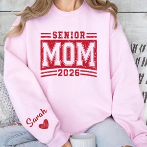 Senior Parent Shirt, Senior Mom 2026 Tee, Graduation Mom Crewneck, Personalized Sleeve Name Sweatshirt, Class of 2026 Senior Mom Outfit, School Spirit Mom Clothing, Varsity Letter Mom Shirt, Graduation Support Apparel, High School Mom Tee, Senior Event Shirt, Graduation Year Mom Sweater, Proud Senior Parent Shirt, Senior Night Outfit, Custom Mom Shirt, Grad 2026 Clothing