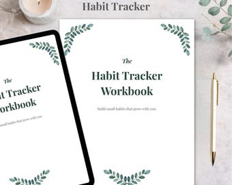 May include: A digital and printable habit tracker workbook with the text "The Habit Tracker Workbook". The workbook has a white background with green leaf accents. A tablet and pen are also visible.