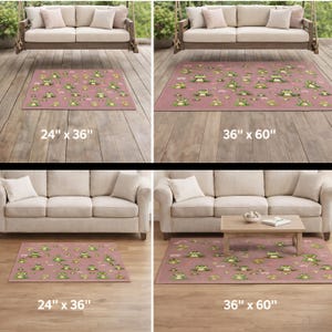 May include: Pink area rugs with a repeating pattern of green frogs and lily pads. The rugs are available in two sizes: 24 inches by 36 inches and 36 inches by 60 inches.