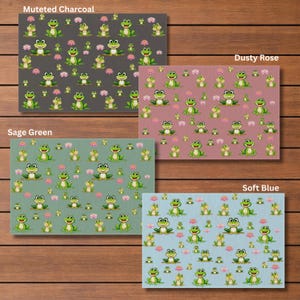May include: Four rectangular decorative panels with frog and flower patterns in muted charcoal, dusty rose, sage green, and soft blue. Each panel features a repeating pattern of smiling green frogs and pink flowers.