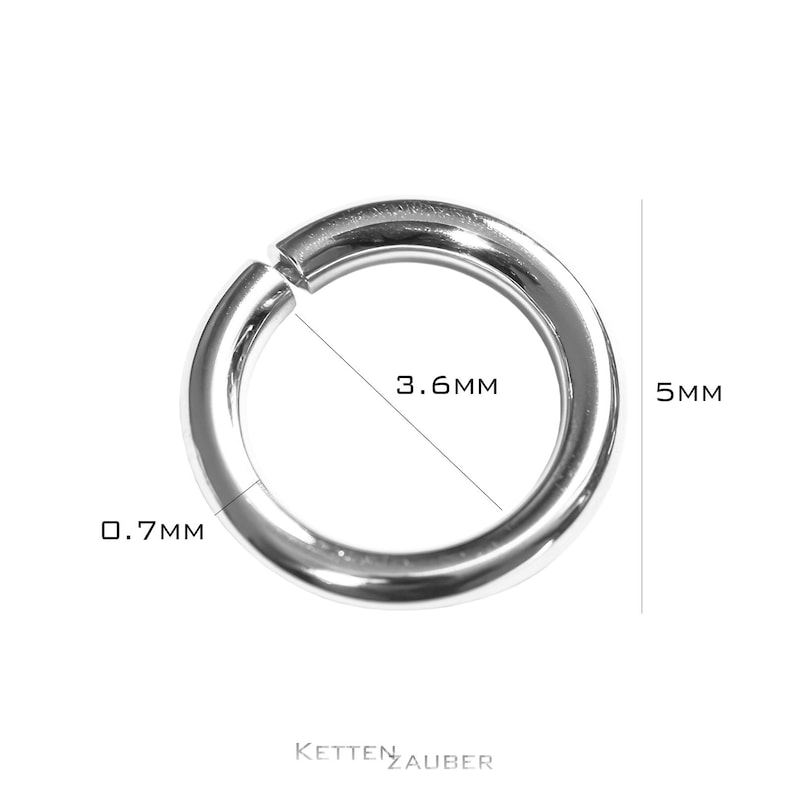 May include: A silver ring with a 0.7 mm thickness and a 3.6 mm inner diameter. The ring is 5 mm in diameter.