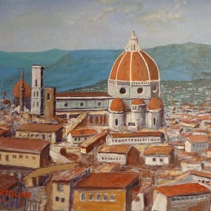 May include: An oil painting depicts a cityscape with a large cathedral featuring a prominent orange dome and a tall bell tower. The buildings have red-tiled roofs, and the background shows a blue sky and a green mountain range. The artwork is signed in the lower left corner.