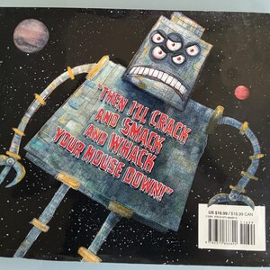 May include: A children's book cover featuring a cartoon robot in space. The robot is gray and blue with multiple red-eyed eyes and a menacing expression. Text on the cover reads "THEN I'LL CRACK AND SMACK AND WHACK YOUR HOUSE DOWN!"