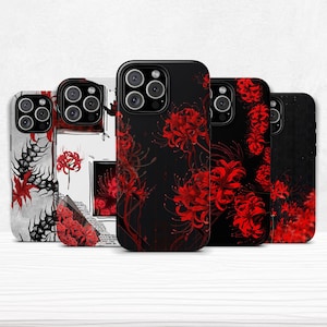 May include: A collection of five phone cases with floral designs. The cases feature a variety of patterns, including red spider lilies on black backgrounds and abstract designs with red and black elements. The cases are for a smartphone.