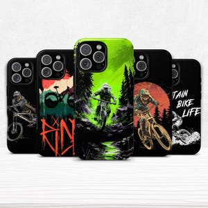 May include: A set of black phone cases with mountain bike graphics. Each case displays a unique illustration of a cyclist on a mountain bike, with vivid colours and dynamic designs. Some cases include the text "TAIN BIKE LIFE".