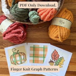 May include: A collection of colorful yarn skeins in shades of orange, green, and red, alongside printed finger knit graph patterns. The patterns feature pumpkin, plaid, and leaf designs. Text on the image reads "PDF Only Download" and "Finger Knit Graph Patterns."