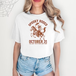 Spooky Rodeo Halloween Shirt | Funny Skeleton Cowboy Tee | Western Halloween Shirt | You Just Yee’d Your Last Haw Tee