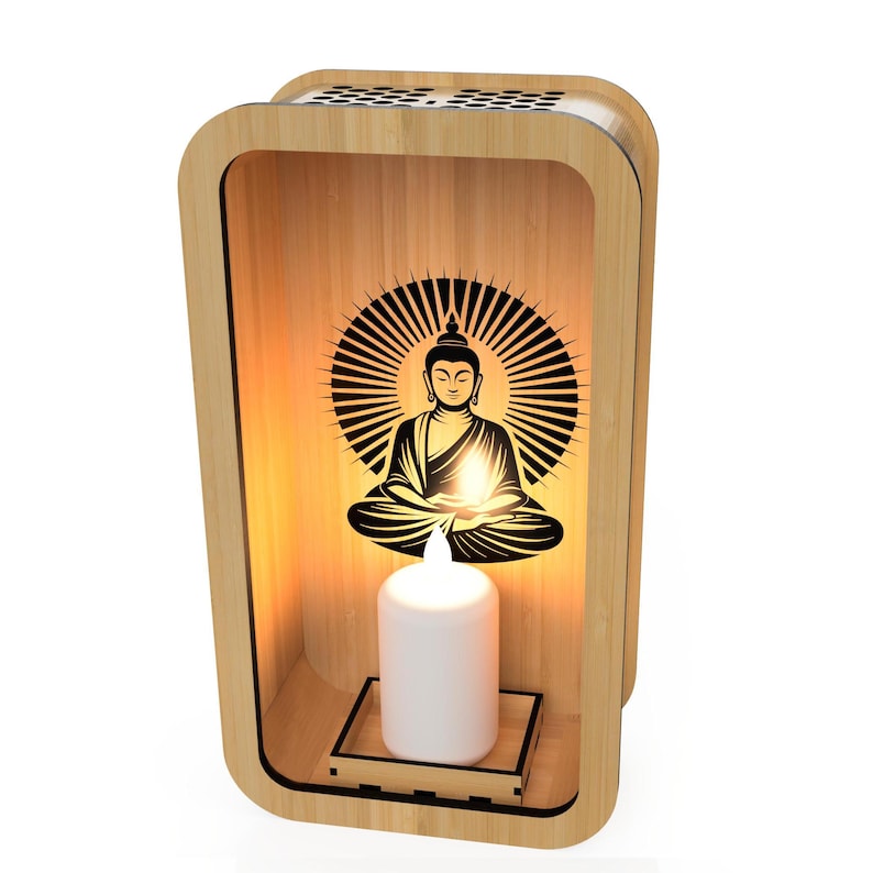 May include: A wooden Buddha candle holder with a warm, inviting glow. The design features a silhouette of Buddha with a radiant halo, and a white candle. The frame is made of light-colored wood.