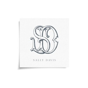May include: A square card with a gray monogram of the letters "S" and "D" in an elegant, intertwined design. The name "SALLY DAVIS" is printed in a simple font below the monogram on a white background.