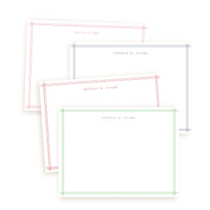 May include: Four white notecards with colored borders and text. The borders are in pink, red, blue, and green. The text on the cards reads "ELLEN STARK" and "THOMAS W. STARK". The cards are stacked on a white background.