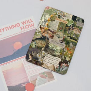 May include: A rectangular decorative magnet with a collage design featuring floral elements, book pages, and the text "Most ardently." A second card with the text "RYTHING WILL FLOW" is also visible. The color palette includes pink, green, and beige.