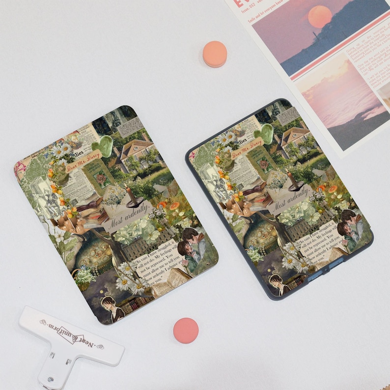 May include: Two phone cases with a collage design featuring floral elements, vintage book pages, and illustrations. The cases have a romantic, antique aesthetic with the words "Most ardently" visible. One case has a black border, the other has a white border.