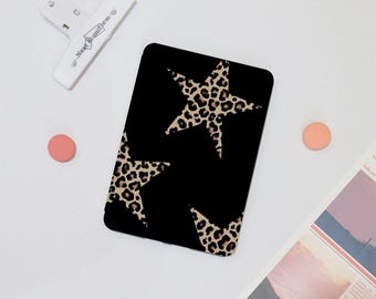 May include: Black tights with a leopard print star pattern.