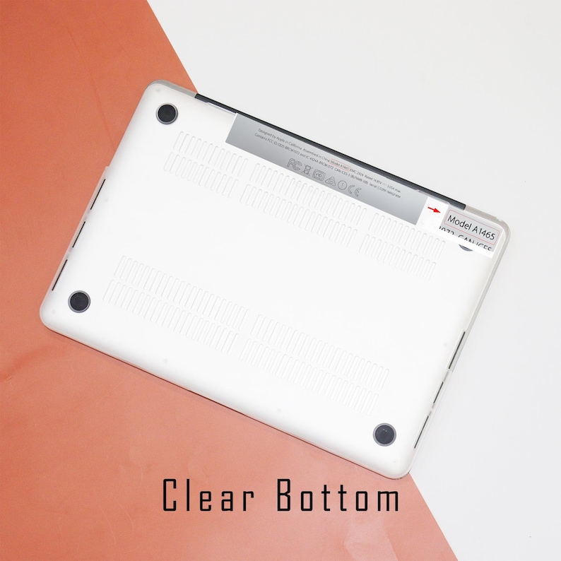 May include: White laptop computer with a clear bottom. The bottom of the laptop has a label that says "Model A1465".