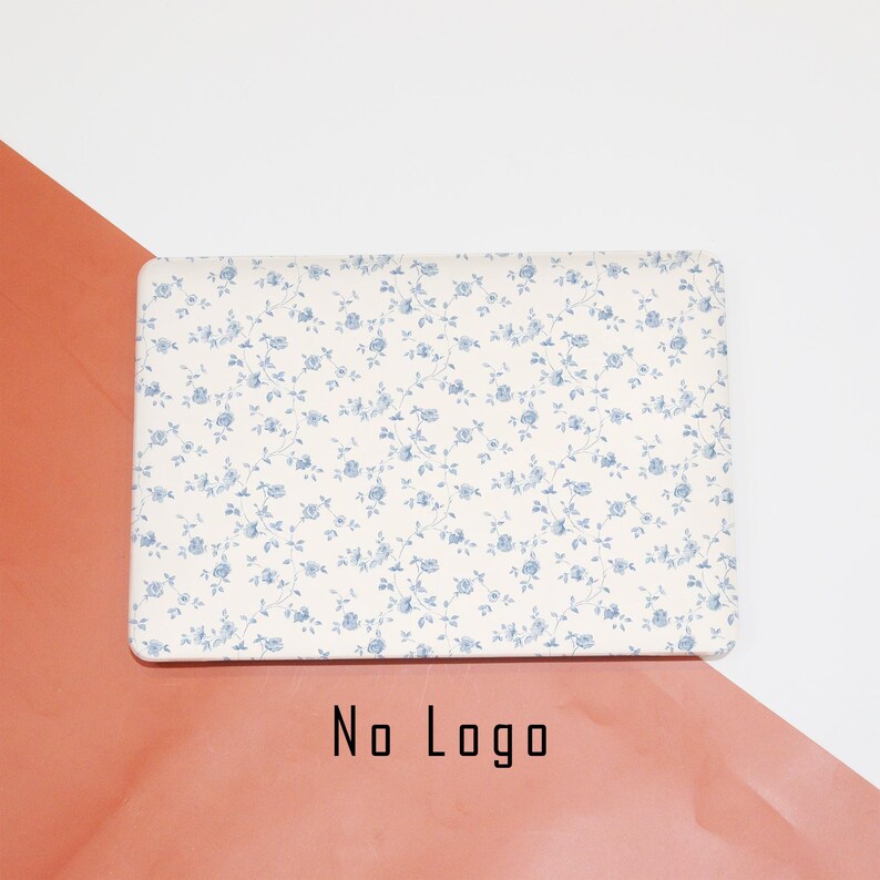May include: A white rectangular serving tray with a blue floral pattern. The tray is made of a durable material and is perfect for serving snacks, appetizers, or desserts.