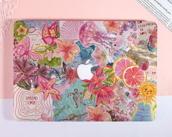 May include: A decorative laptop case featuring a collage of colorful illustrations. The design includes butterflies, flowers, sea creatures, and text that reads "Spread Love" and "Do Everything in Love". The case has a white Apple logo.