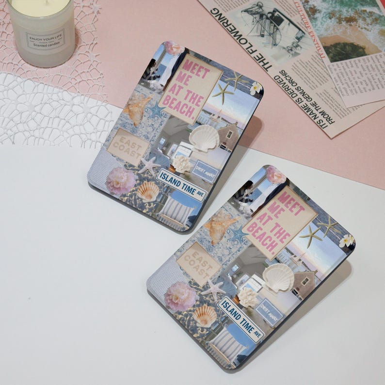 May include: Two blue and white patterned covers for an e-reader. The covers feature a collage of images including seashells, a beach scene, and the text "Meet me at the beach." and "Island Time Ave."
